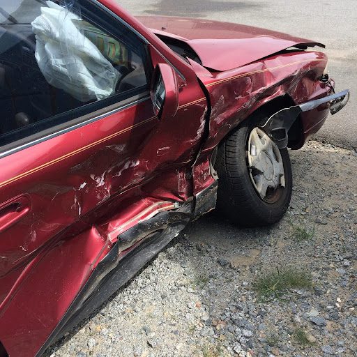 side damage on a red car